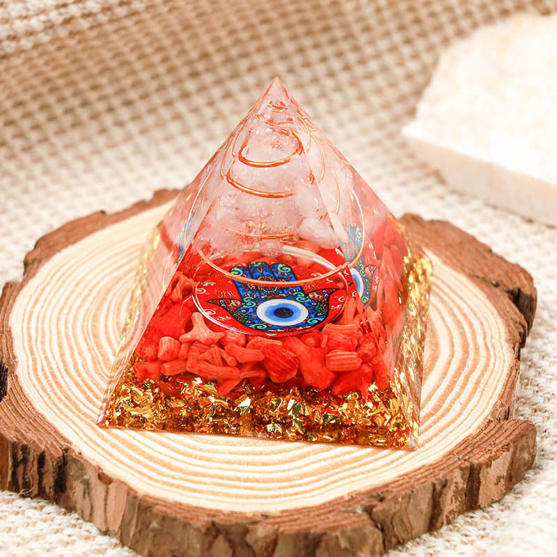 Quartz clair Olivenorma avec corail rouge Hamsa et pyramide orgone du mauvais œil