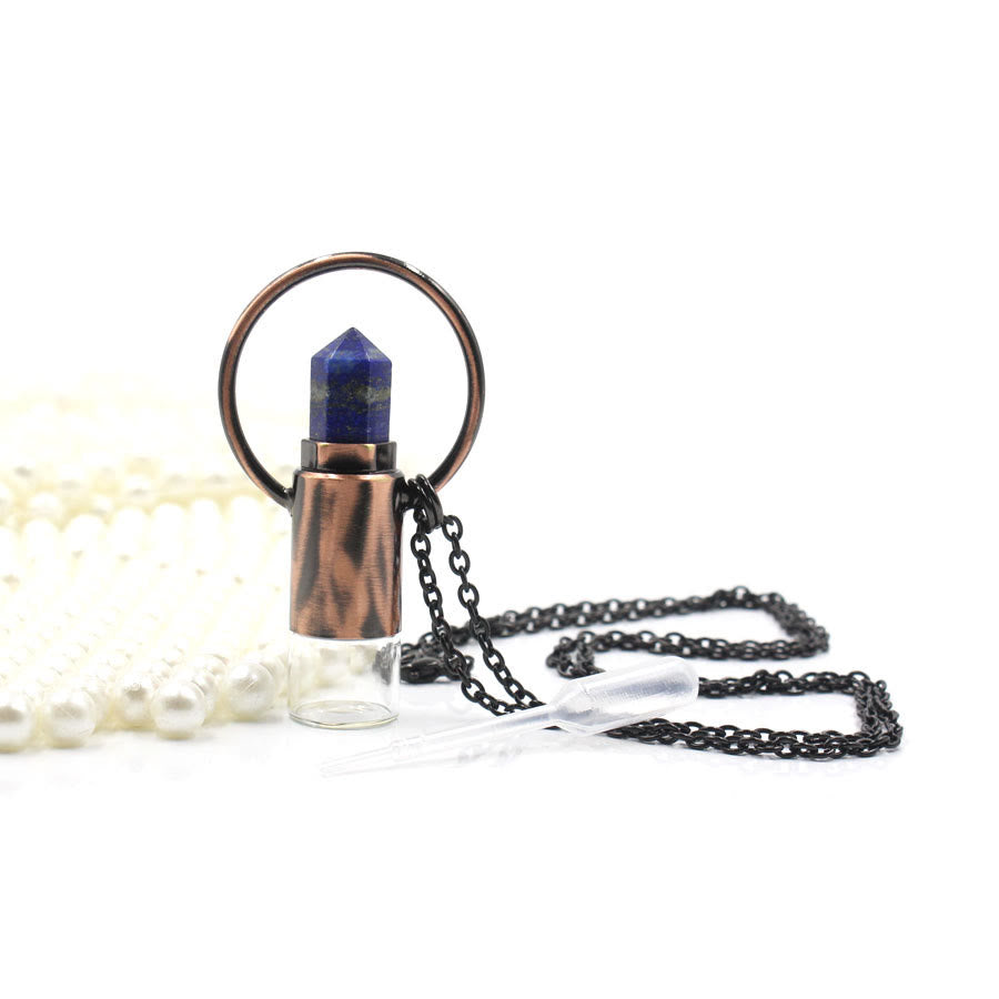 Pendentif bouteille de parfum en cristal naturel prismatique Olivenorma