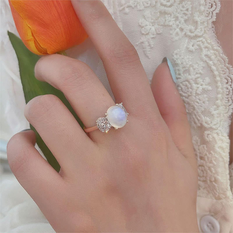 Bague en or rose avec trois diamants et pierre de lune et zircon blanc Olivenorma