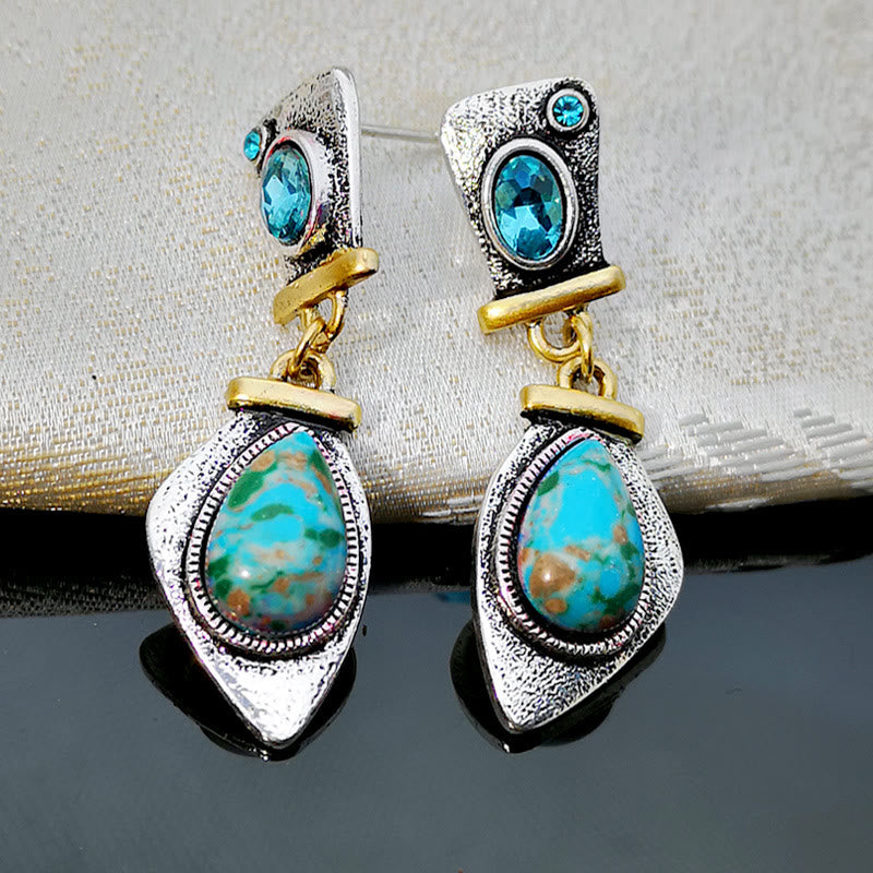 Boucles d'oreilles en argent avec topaze bleue et pierre empereur Olivenorma 