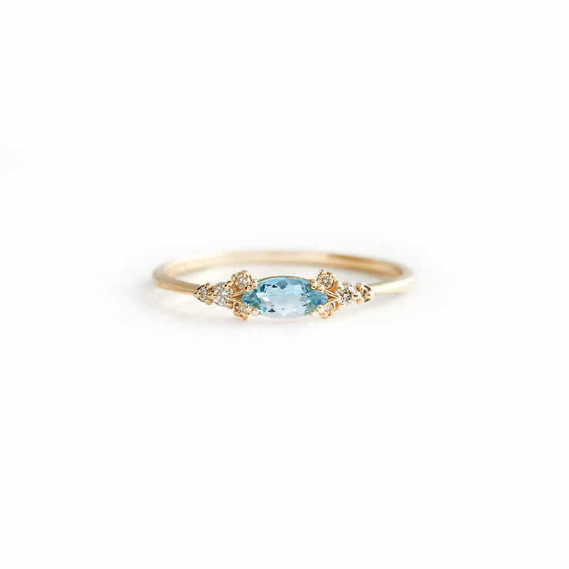 Ensemble de 4 bagues de fiançailles élégantes en topaze bleue avec feuille Olivenorma