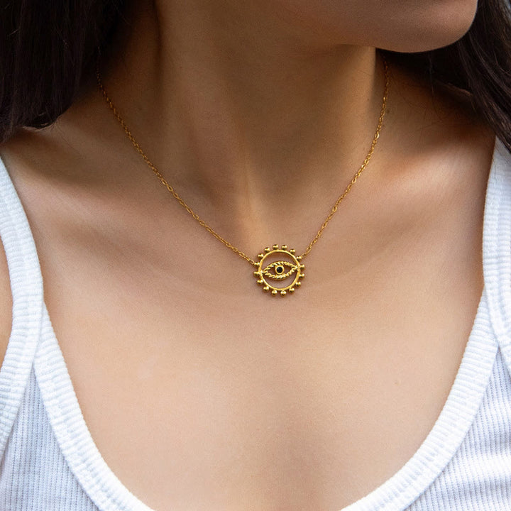 Collier rond creux en acier inoxydable plaqué or 18 carats avec mauvais œil Olivenorma
