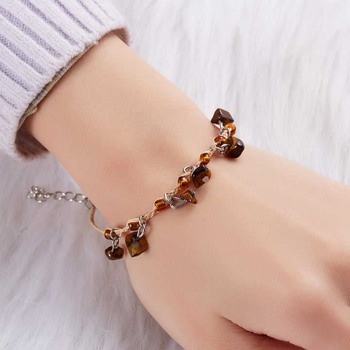 Bracelet tressé en gravier avec pompon en obsidienne et améthyste œil de tigre Olivenorma