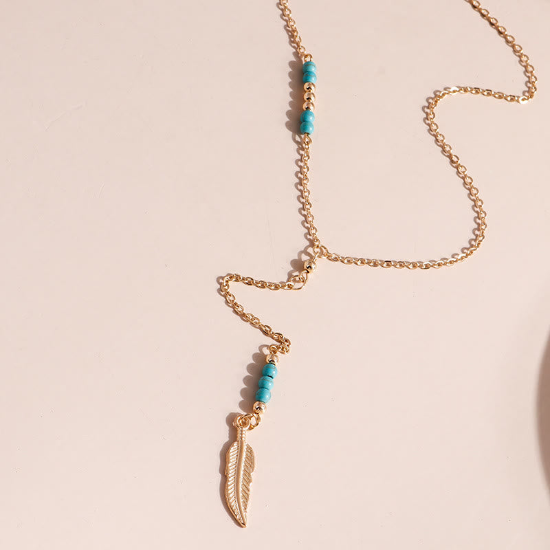 Collier bohème en argent et or avec pendentif en forme de feuille turquoise Olivenorma