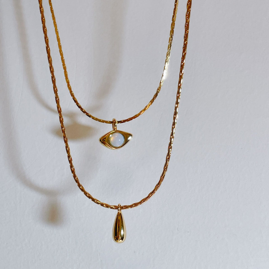 Collier double couche avec pendentif en opalite contre le mauvais œilnorma Olivenorma 