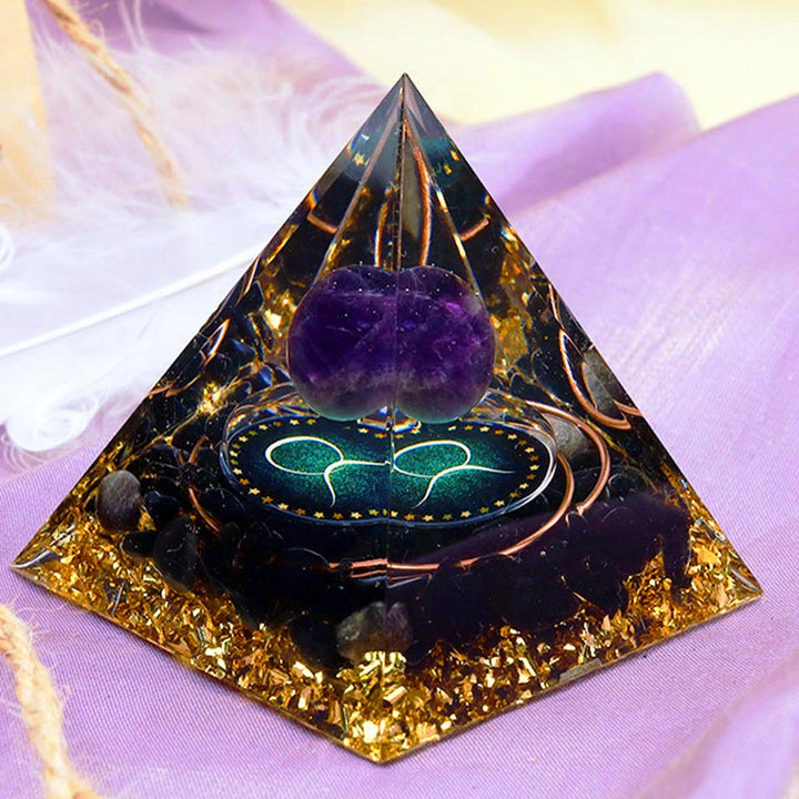 Sphère d'améthyste Olivenorma avec pyramide d'orgone du zodiaque Taureau en obsidienne