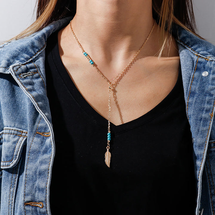 Collier bohème en argent et or avec pendentif en forme de feuille turquoise Olivenorma