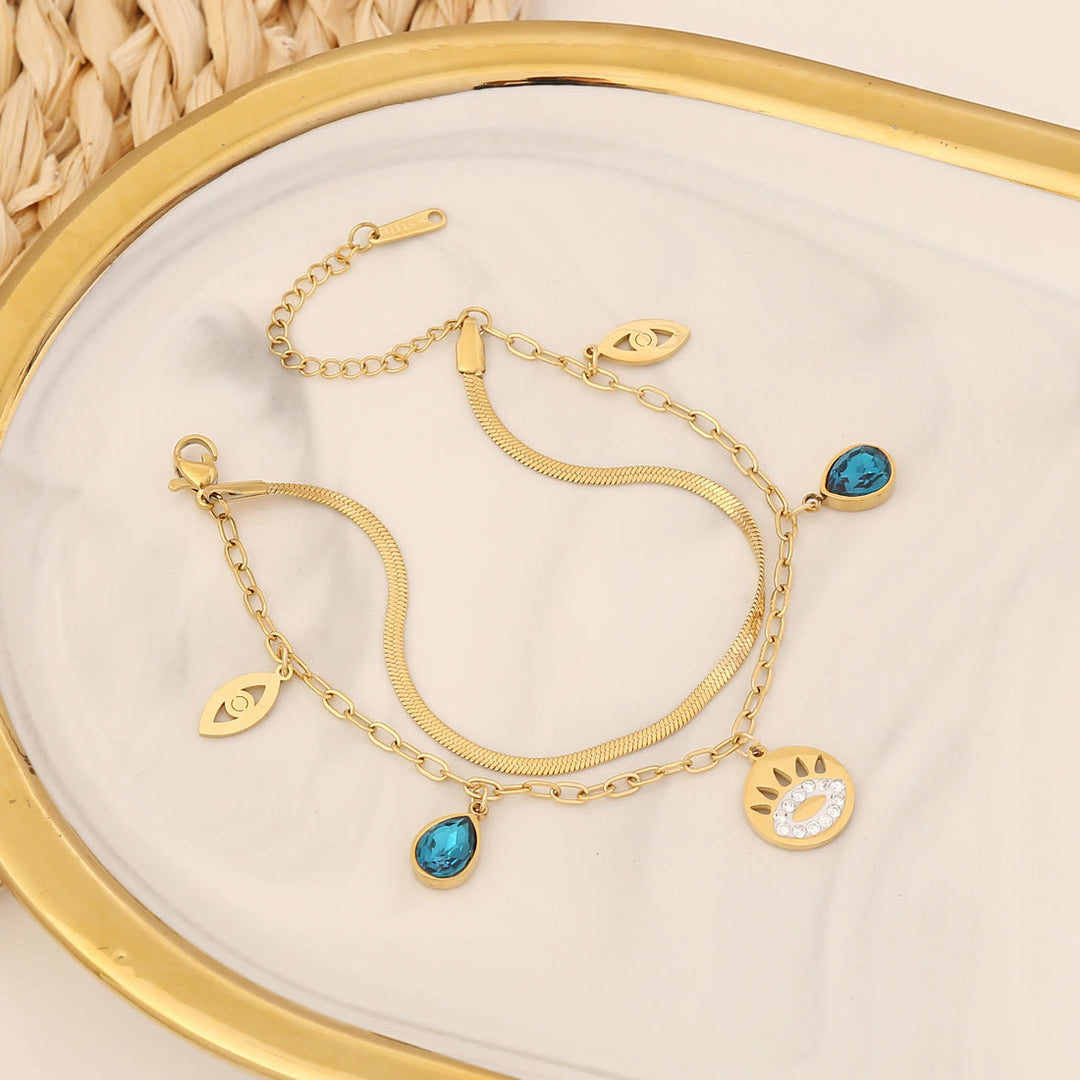 Bracelet porte-bonheur Olivenorma en époxy avec topaze bleue et trèfle mauvais œil