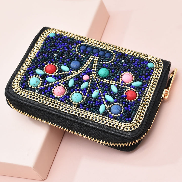 Pochette Olivenorma en perles de riz turquoise à motif arbre de vie