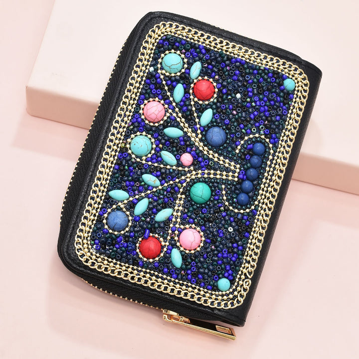 Pochette Olivenorma en perles de riz turquoise à motif arbre de vie