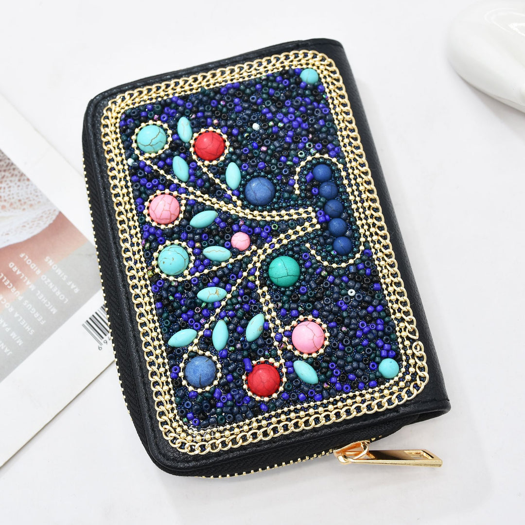 Pochette Olivenorma en perles de riz turquoise à motif arbre de vie