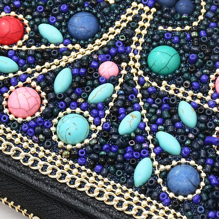 Pochette Olivenorma en perles de riz turquoise à motif arbre de vie