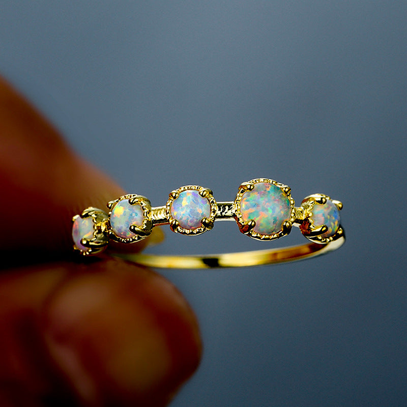 Bague Olivenorma à cinq motifs simples en opale bleue et blanche