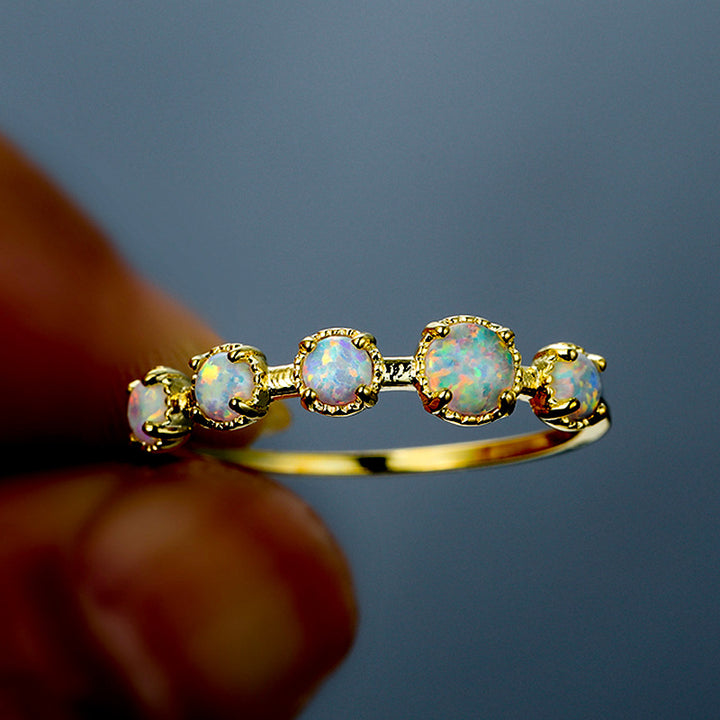 Bague Olivenorma à cinq motifs simples en opale bleue et blanche