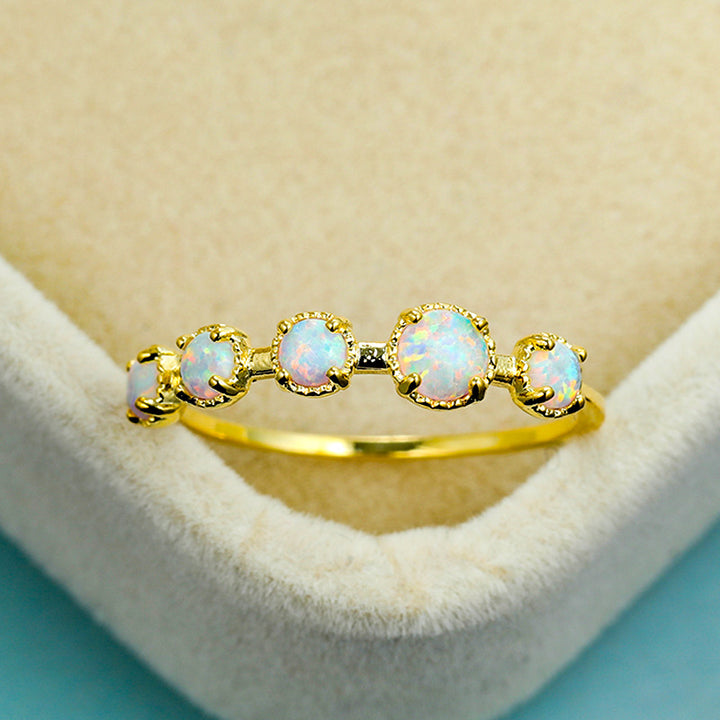 Bague Olivenorma à cinq motifs simples en opale bleue et blanche
