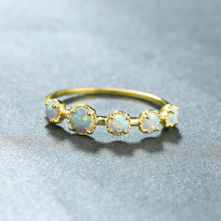 Bague Olivenorma à cinq motifs simples en opale bleue et blanche