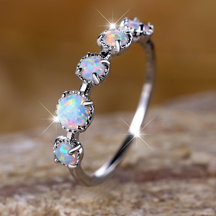 Bague Olivenorma à cinq motifs simples en opale bleue et blanche