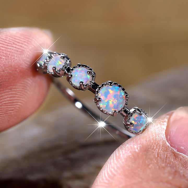 Bague Olivenorma à cinq motifs simples en opale bleue et blanche