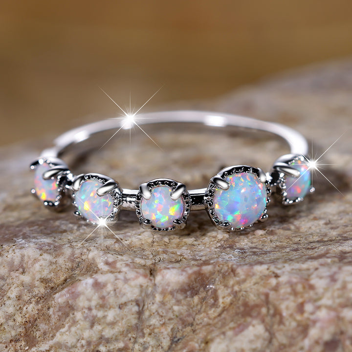 Bague Olivenorma à cinq motifs simples en opale bleue et blanche