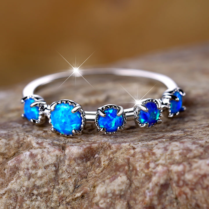 Bague Olivenorma à cinq motifs simples en opale bleue et blanche