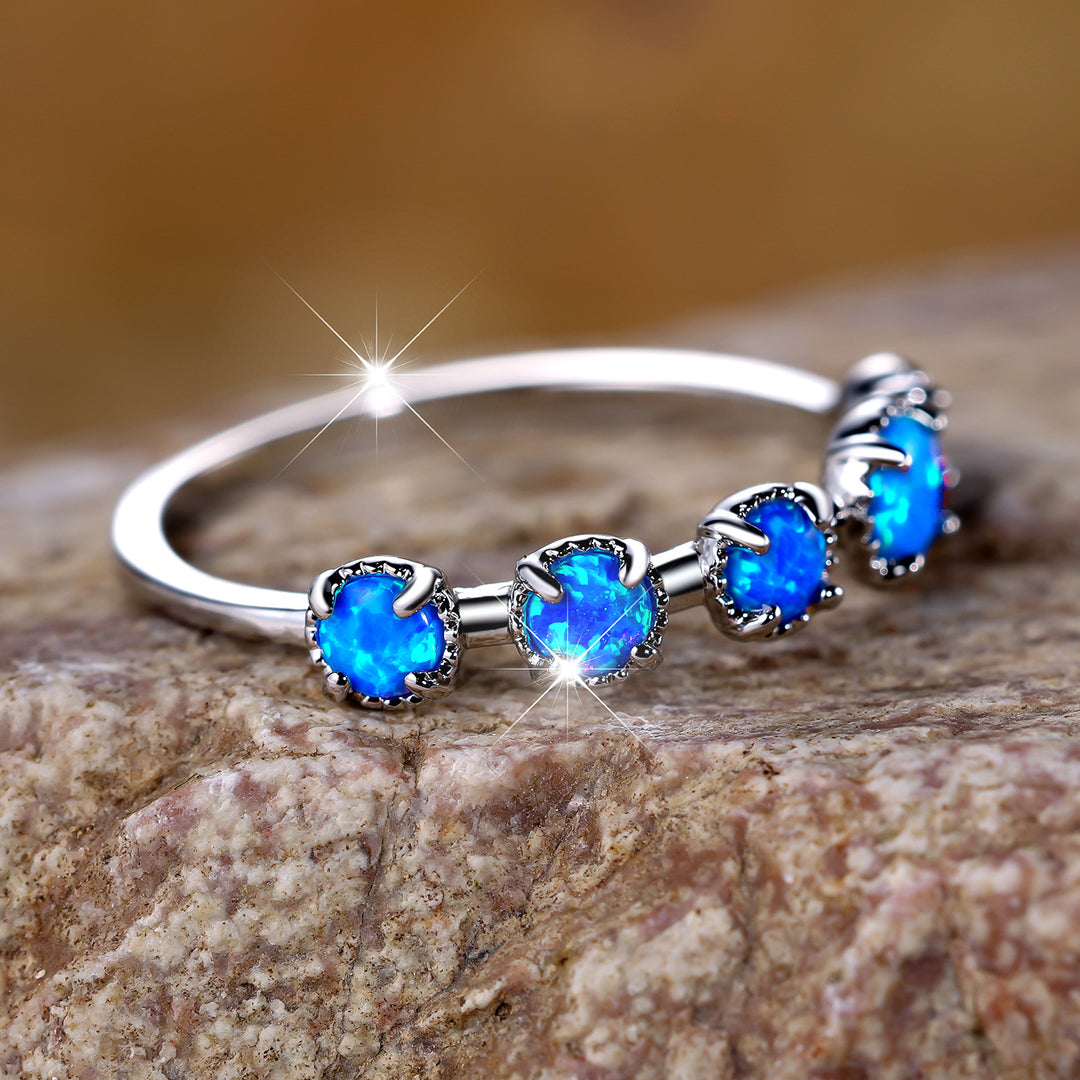 Bague Olivenorma à cinq motifs simples en opale bleue et blanche