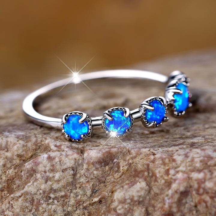 Bague Olivenorma à cinq motifs simples en opale bleue et blanche