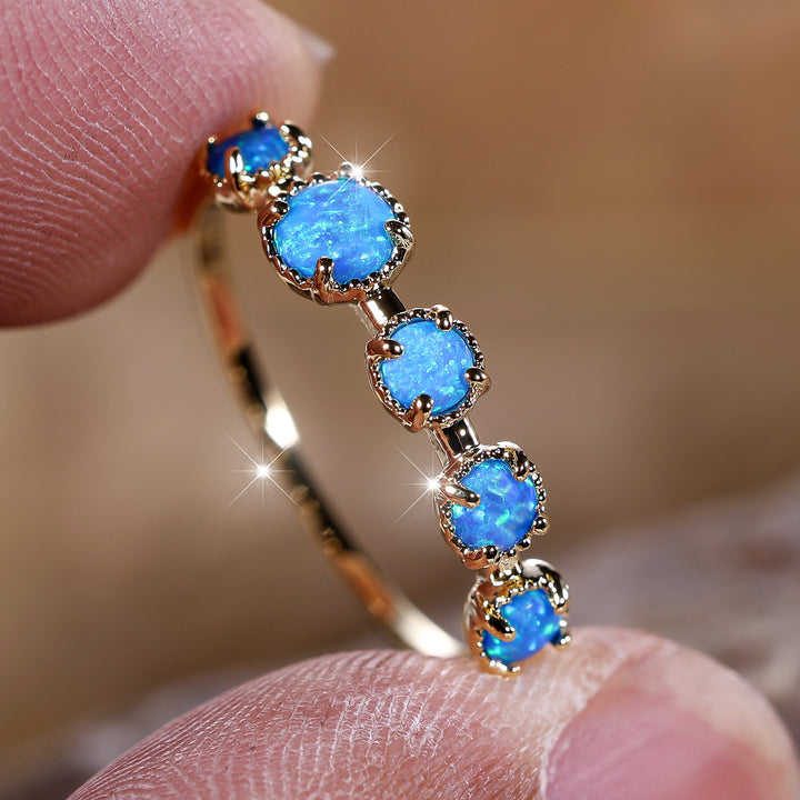 Bague Olivenorma à cinq motifs simples en opale bleue et blanche