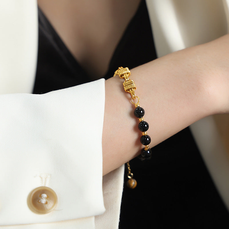 Bracelet en acier titane et perles d'onyx noir et d'agate Olivenorma