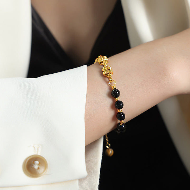 Bracelet en acier titane et perles d'onyx noir et d'agate Olivenorma