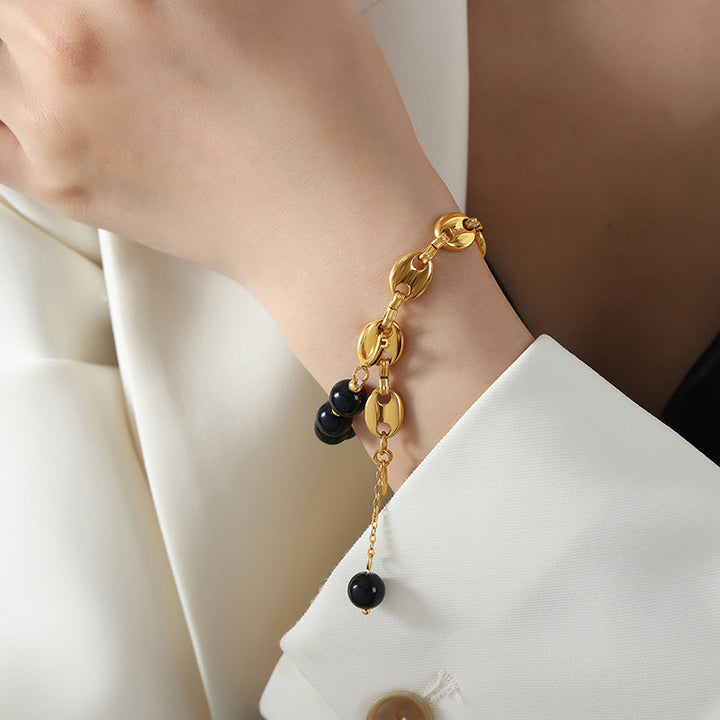 Bracelet en acier titane et perles d'onyx noir et d'agate Olivenorma