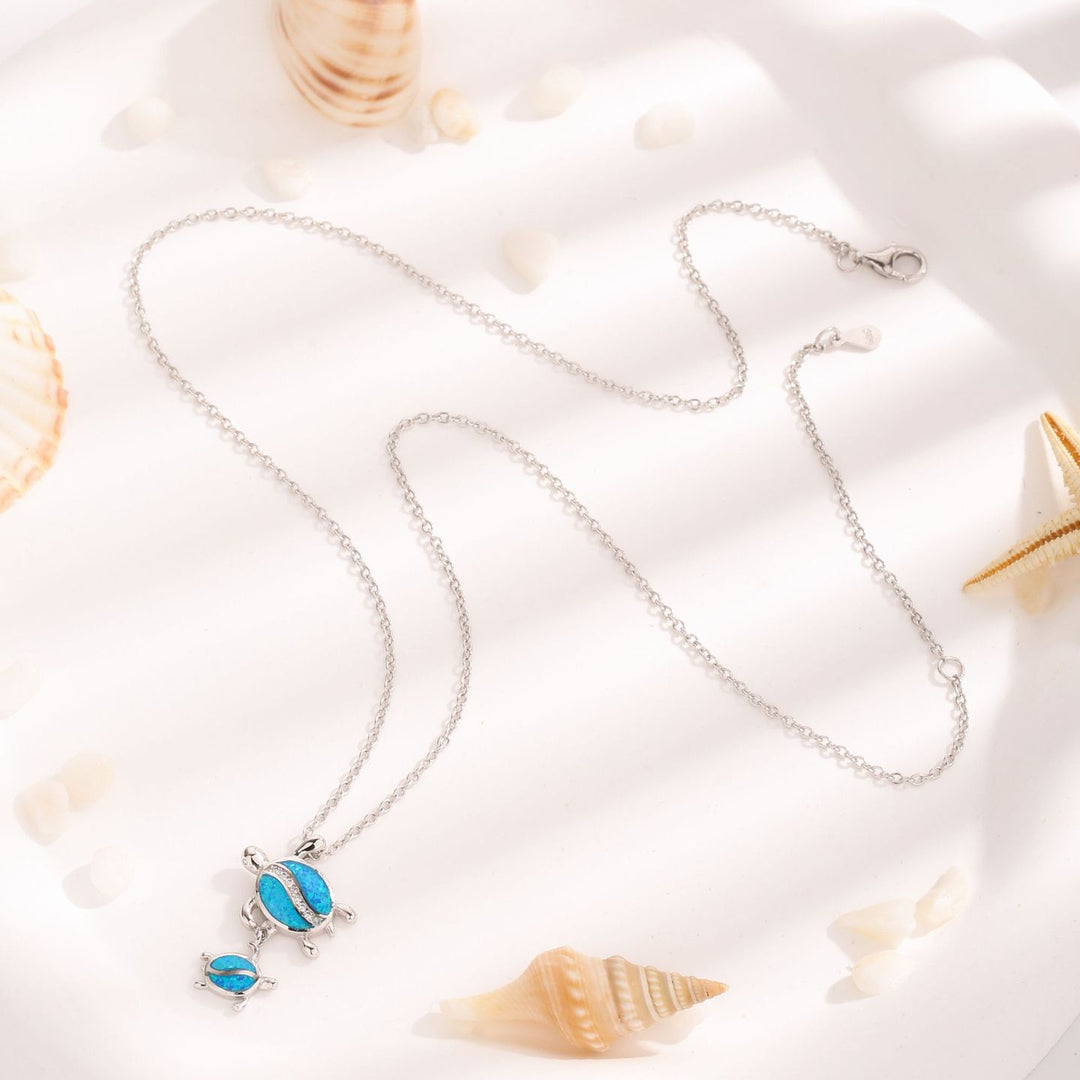 Collier avec pendentif double tortue en opale bleue Olivenorma