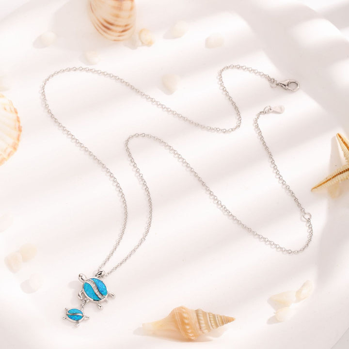 Collier avec pendentif double tortue en opale bleue Olivenorma