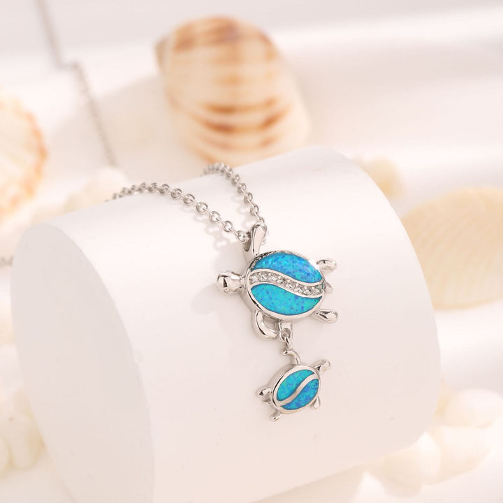 Collier avec pendentif double tortue en opale bleue Olivenorma