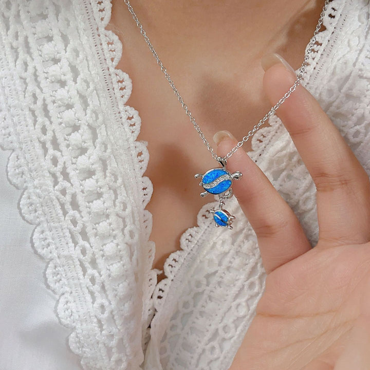 Collier avec pendentif double tortue en opale bleue Olivenorma