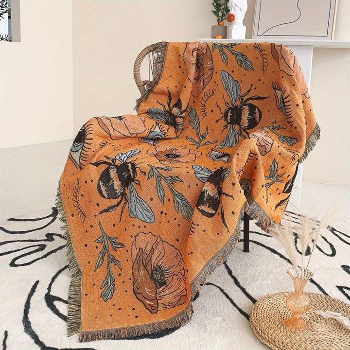 Couverture tissée à pompons avec fleurs de papillon orange Olivenorma