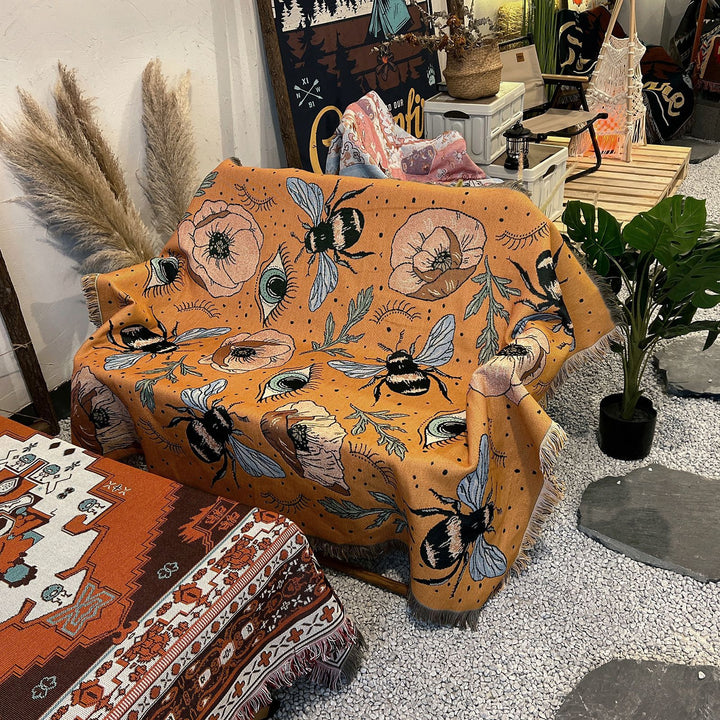 Couverture tissée à pompons avec fleurs de papillon orange Olivenorma