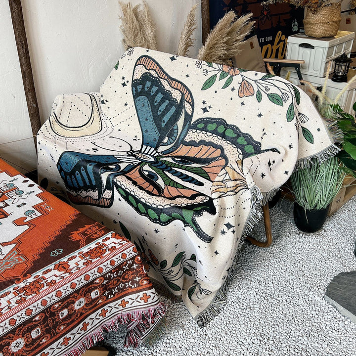 Couverture tissée à pompons avec motif papillon Olivenorma
