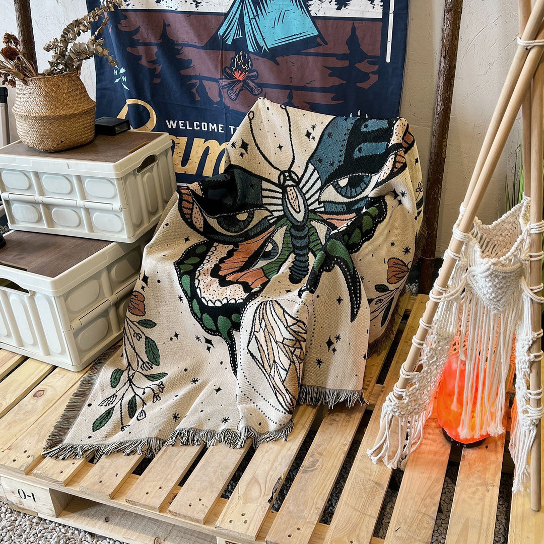 Couverture tissée à pompons avec motif papillon Olivenorma