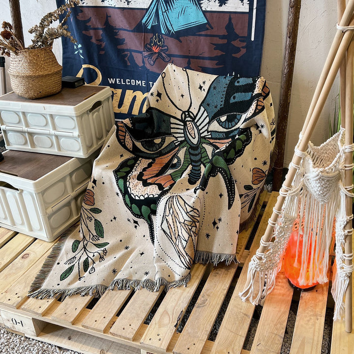 Couverture tissée à pompons avec motif papillon Olivenorma