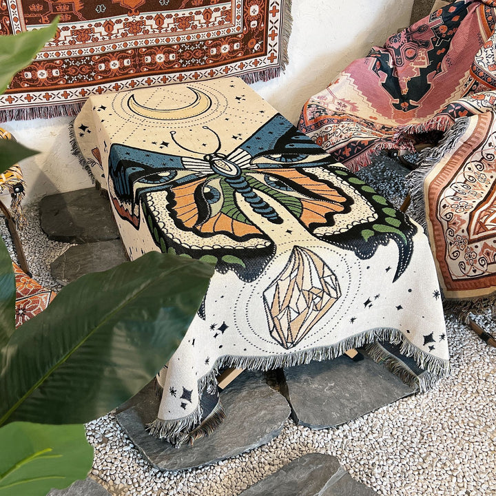 Couverture tissée à pompons avec motif papillon Olivenorma