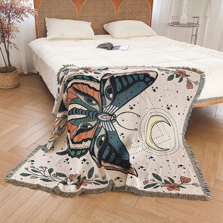 Couverture tissée à pompons avec motif papillon Olivenorma