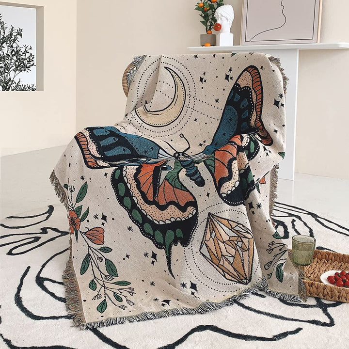 Couverture tissée à pompons avec motif papillon Olivenorma