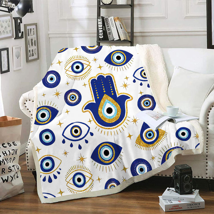 Couverture tissée en œil flanelle blanche et bleue avec motif mauvais et Hamsa Olivenorma