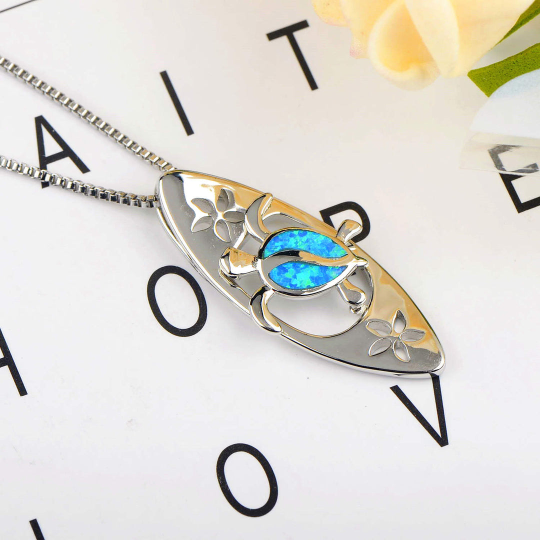 Collier avec pendentif tortue en forme de planche de surf en opale bleue Olivenorma