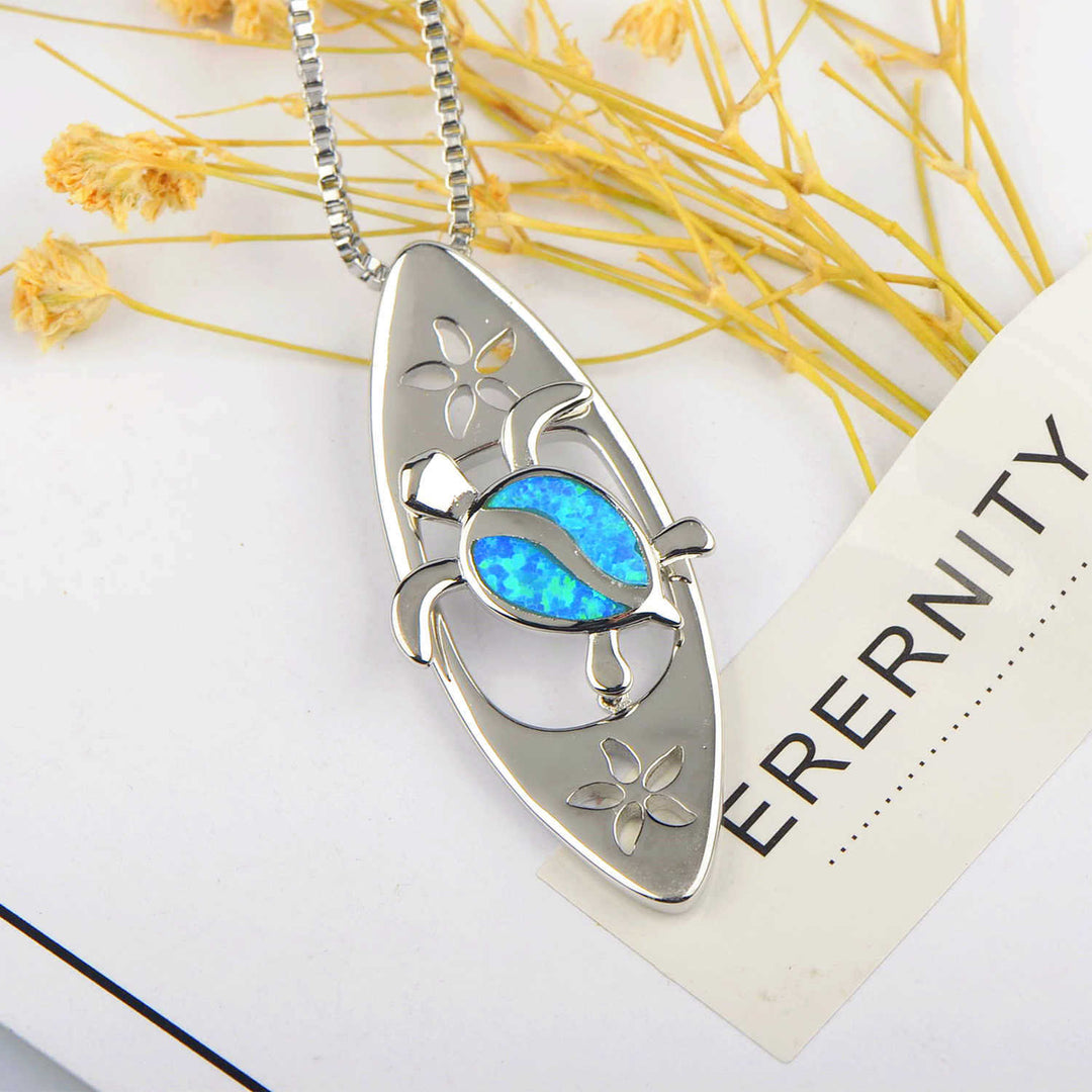 Collier avec pendentif tortue en forme de planche de surf en opale bleue Olivenorma
