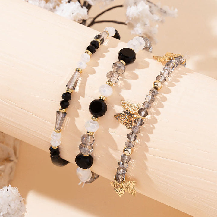 Ensemble de bracelets à trois rangs avec pendentif papillon en or et perles de cristal Olivenorma