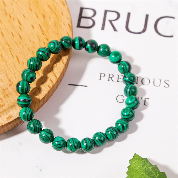 Bracelet Olivenorma en perles de malachite et onyx noir 8 mm