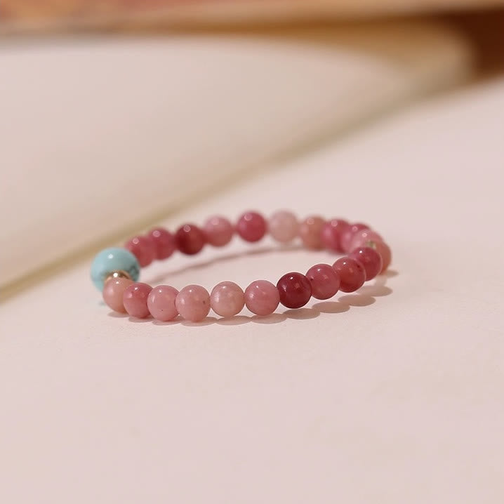 Bague Olivenorma en perles de rhodochrosite extra fines de 2 mm