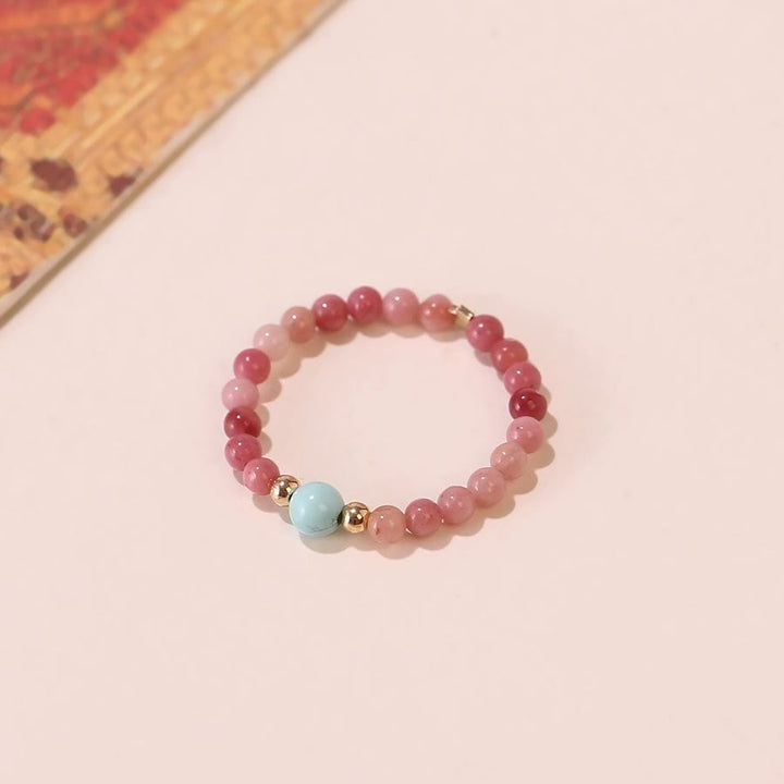 Bague Olivenorma en perles de rhodochrosite extra fines de 2 mm