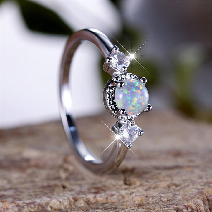 Bague ronde à quatre griffes en opale Olivenorma